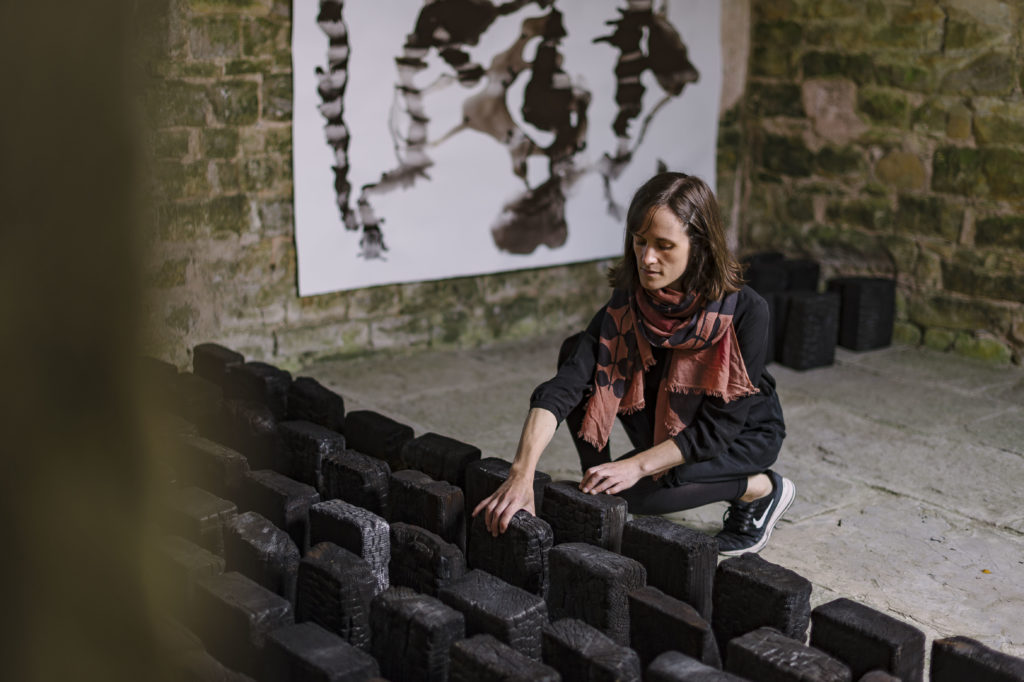 Lotte Scott installing the `Long Hundred' photo Jim Wileman