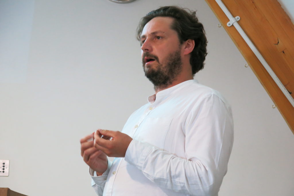 Adam Hogarth speaking at Fragile Nature symposium, 2019