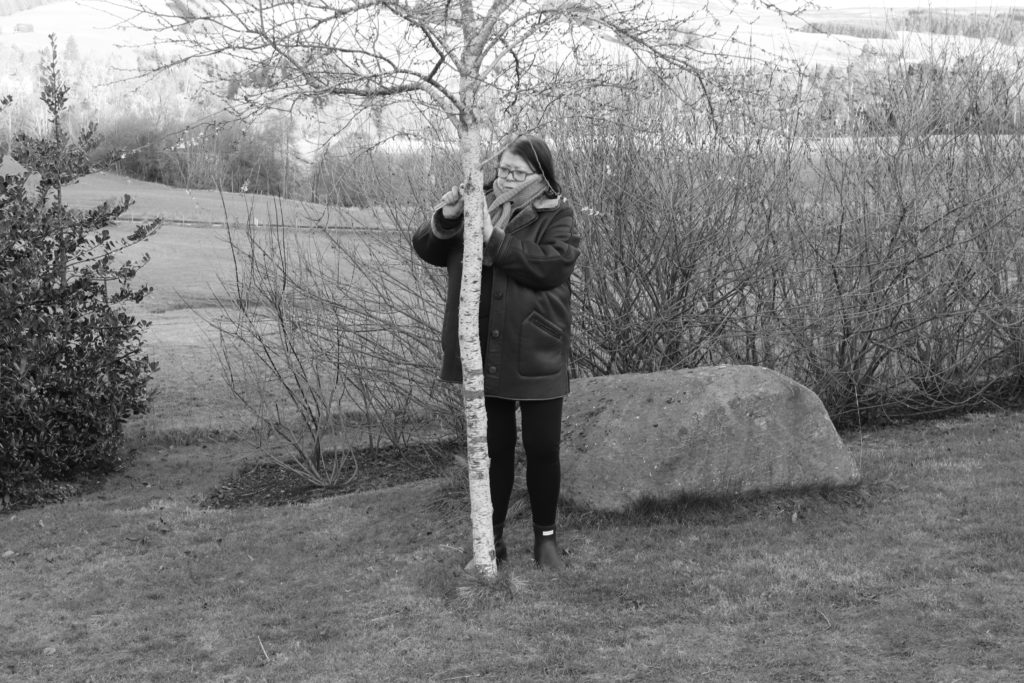 FieldWork: between urban and rural,  Annie Woodford examining lichen
