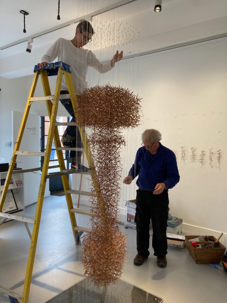 Myka Baum and Chris Drury installing Clud of Thorns