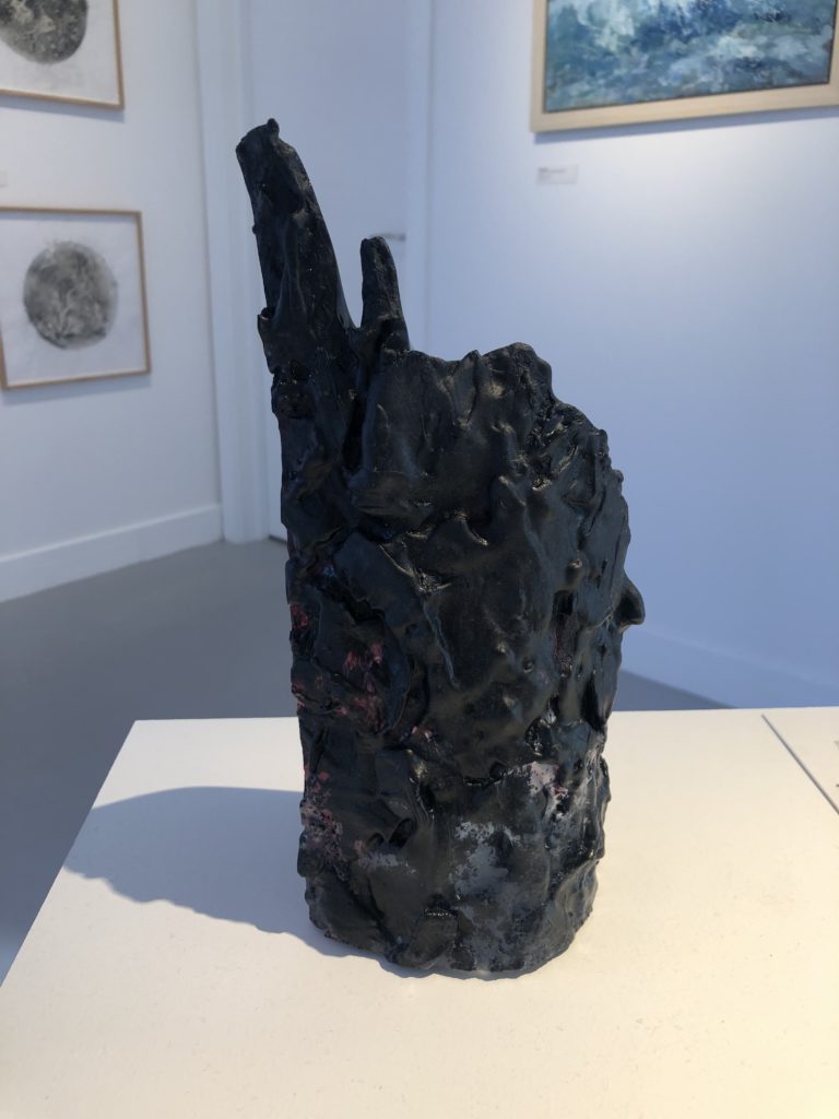 Close up image of Phillipa Silcock's Black Smoker 2 on a white plinth.