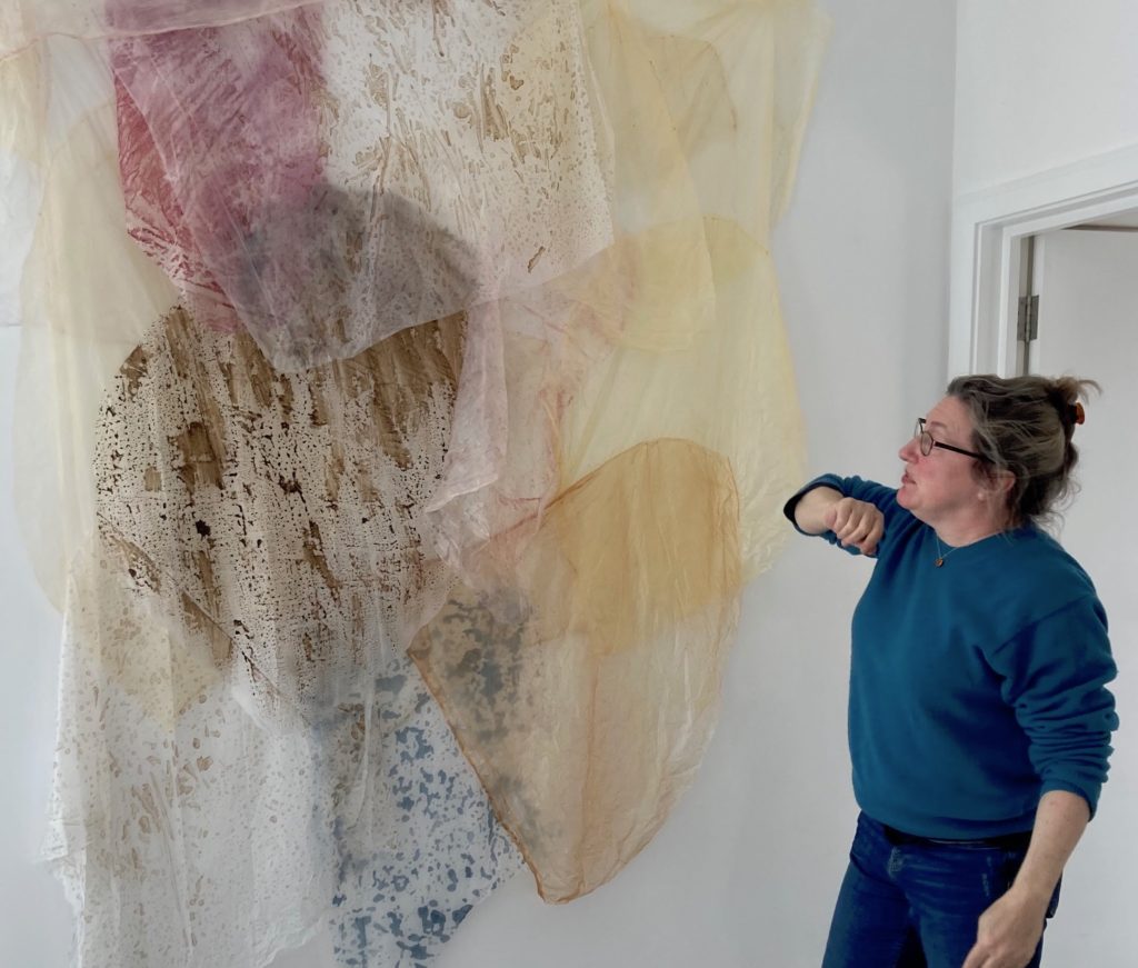 Liz Elto with cornstarch hanging