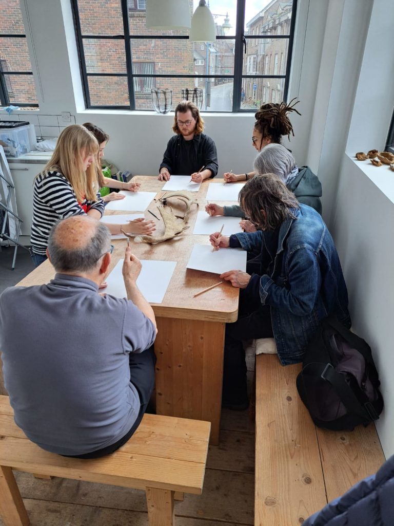 drawing group round the table